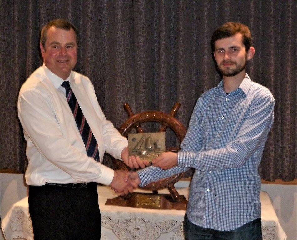 Fishmern's Mission Superintendent Aubrey Jamieson, presenting the Vevoe Trophy to Drew Manson, Sail Trainee of the Year