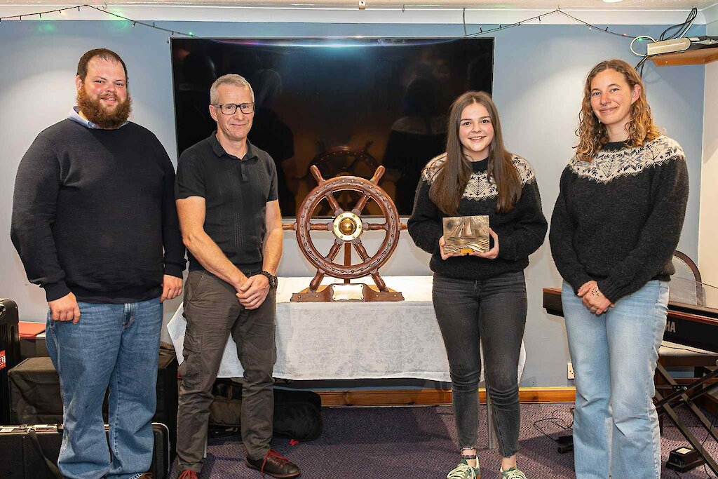 Image by Tom Jamieson - l-r: Scot Sandison (Swan Mate), John Willum Simpson (Swan Trust Trustee), Stella Manson, Eli Pacey (Swan Skipper)