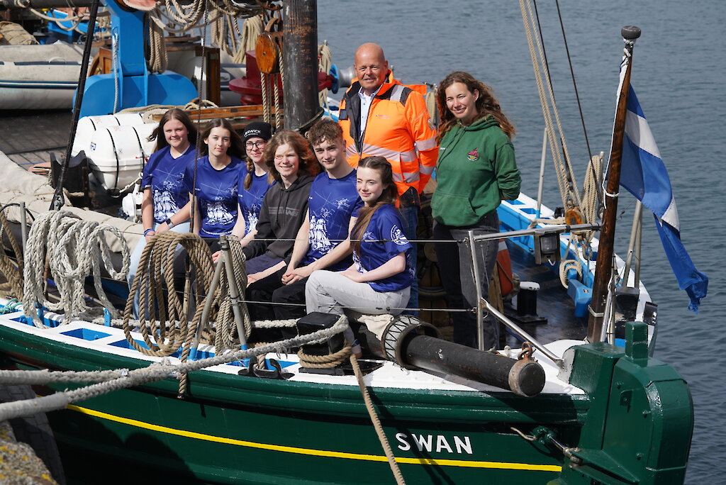Gerrit Jan van den Bosch (Project Manager with Boskalis Westminster Ltd) with Ellie Pearcy (Swan Skipper) and some of the 2026 trainees. Image credit: Tom Jamieson
